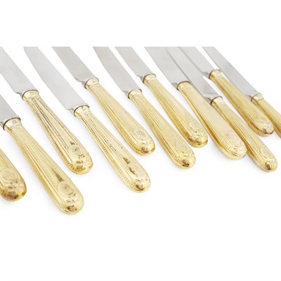 Lot 495 - A RARE SUITE OF TWENTY FOUR GEORGE III SCOTTISH SILVER GILT TABLE AND DESSERT KNIVES