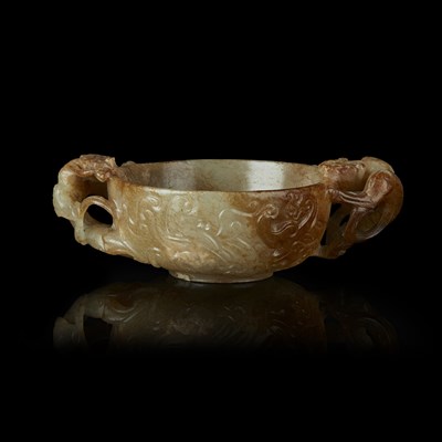 Lot 102 - CELADON AND RUSSET JADE TWIN-HANDLE LIBATION CUP
