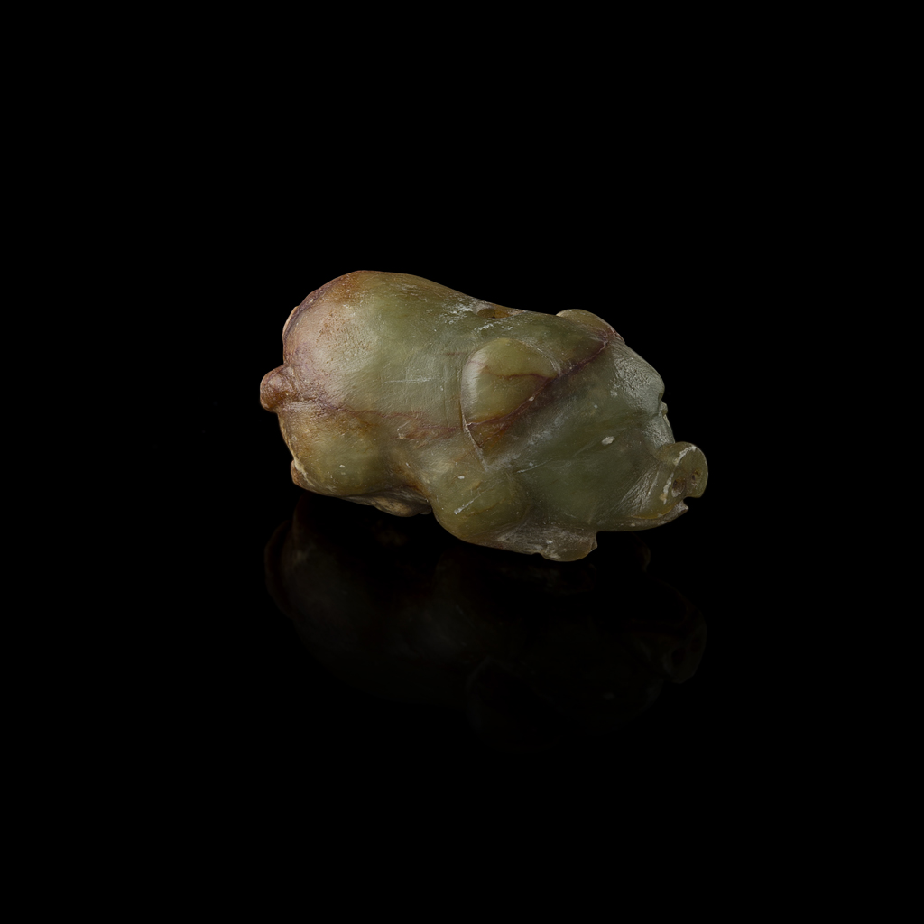 Lot 176 - GREEN AND RUSSET JADE PENDANT IN THE SHAPE OF A PIG