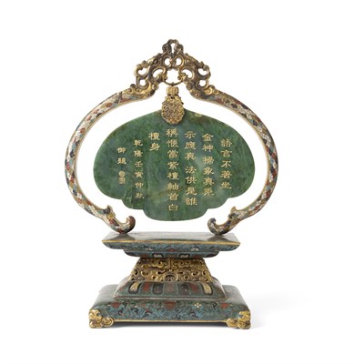 Lot 91 - SPINACH-GREEN JADE PLAQUE MOUNTED ON A CLOISONNÉ ENAMEL DISPLAY STAND