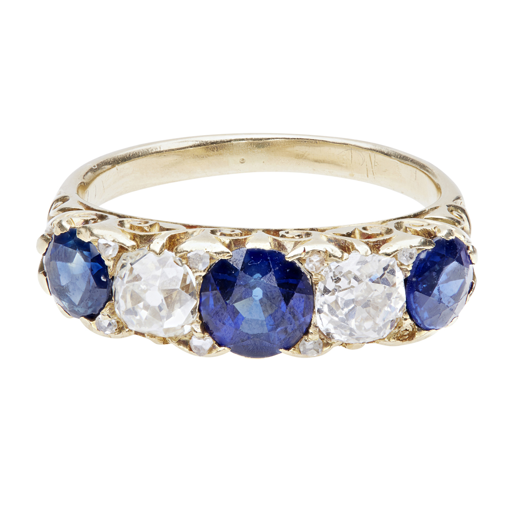 Lot 129 - A five stone sapphire and diamond set ring