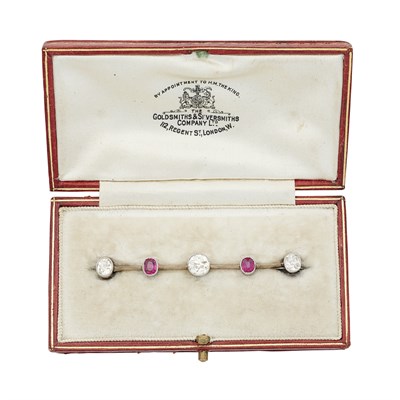 Lot 180 - A diamond and ruby set bar brooch