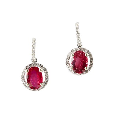 Lot 189 - A pair of ruby and diamond set earrings