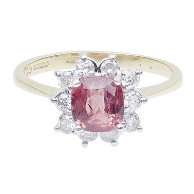Lot 222 - A Padparadscha sapphire and diamond set cluster ring
