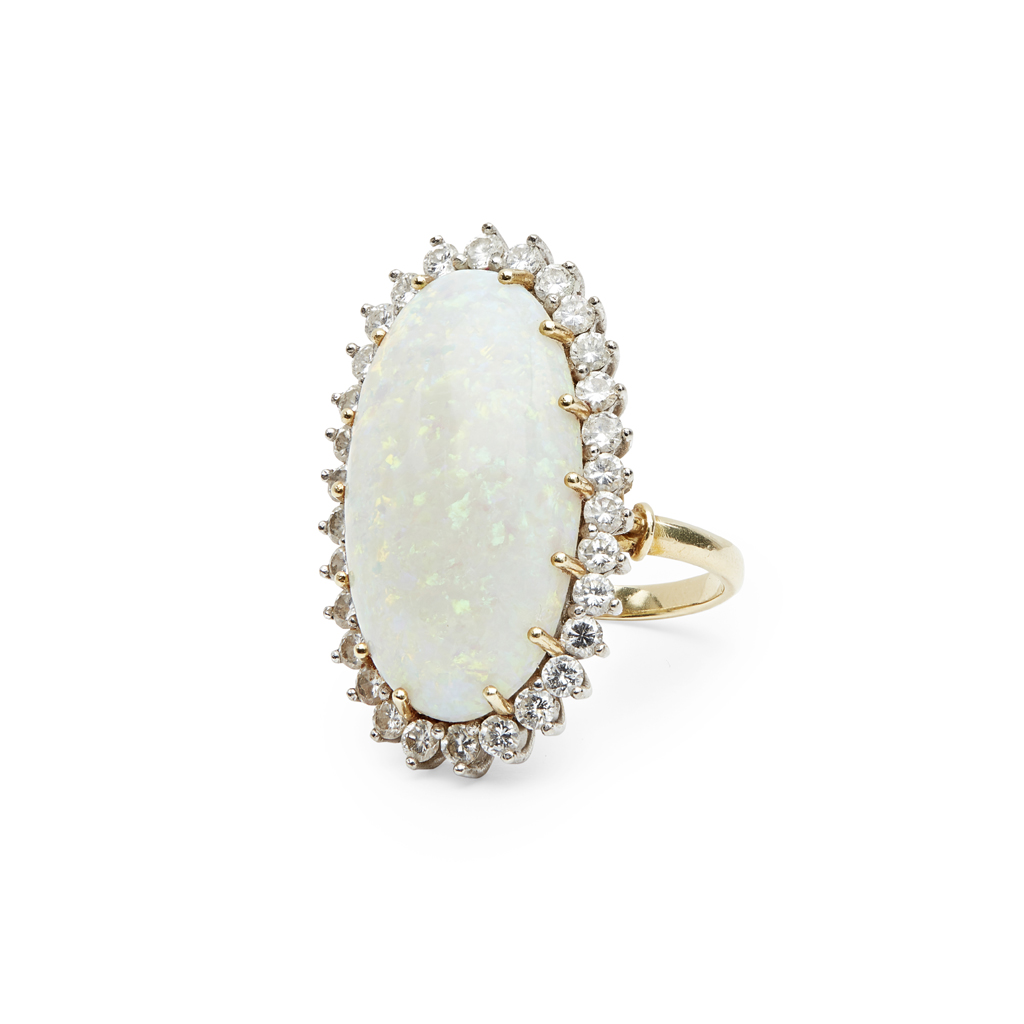 Lot 130 - An opal and diamond set cluster ring