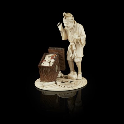 Lot 295 - FINE IVORY, WOOD AND CORAL OKIMONO OF A MAN OPENING A BOX OF TREASURE