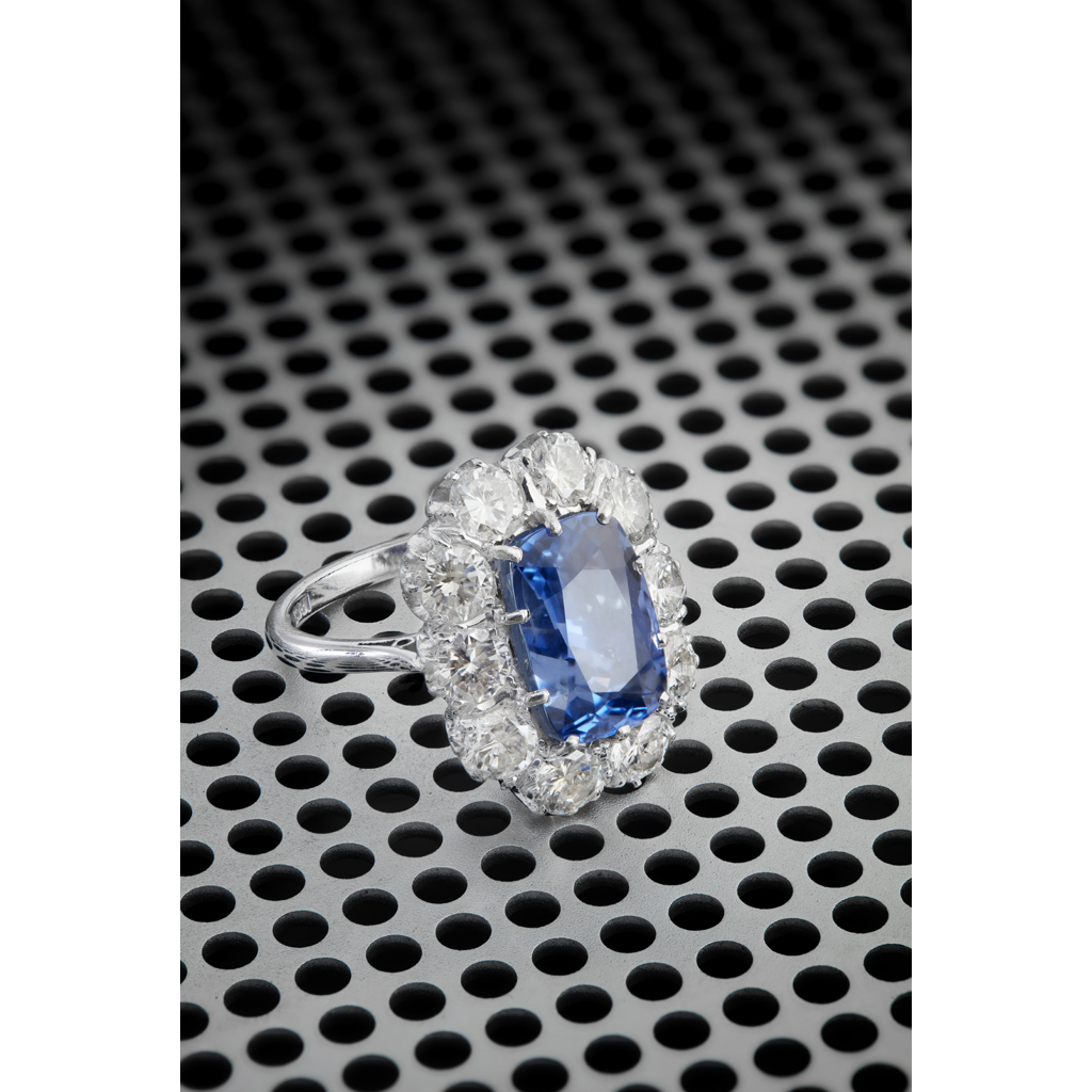 Lot 65 - A large sapphire and diamond set cluster ring