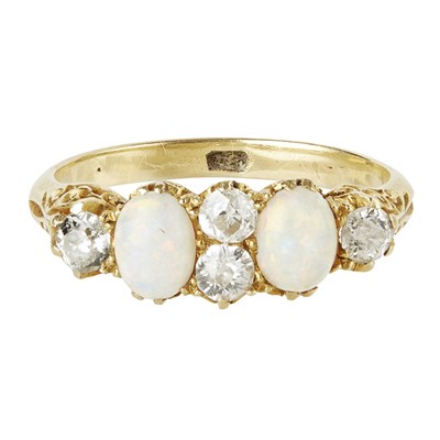 Lot 104 - An opal and diamond set ring