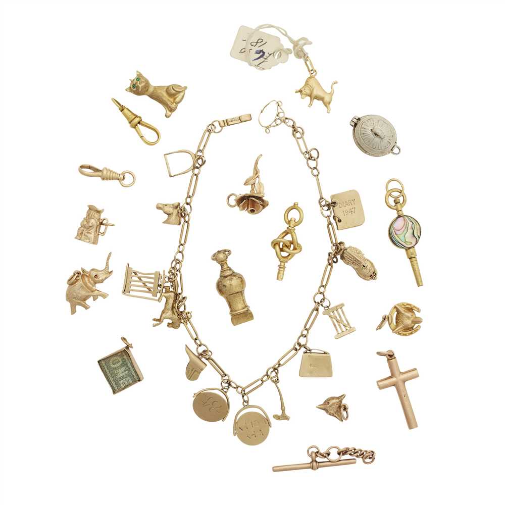Lot 255 - A charm bracelet and collection of loose charms