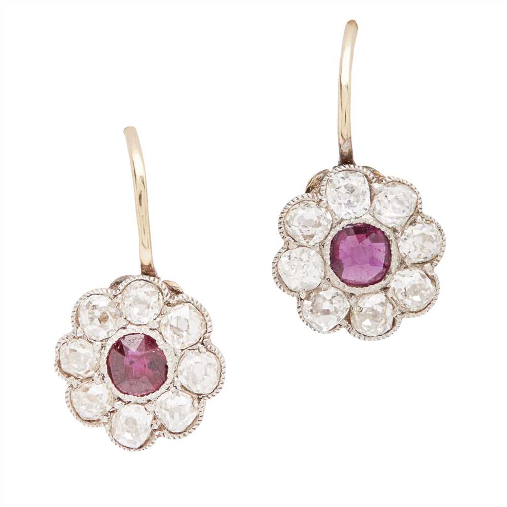 Lot 18 - A pair of ruby and diamond set cluster earrings