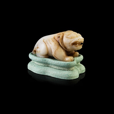 Lot 116 - WHITE JADE CARVING OF A MYTHICAL ANIMAL