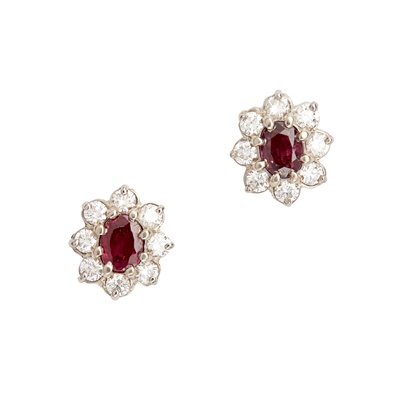 Lot 102 - A pair of ruby and diamond cluster earrings