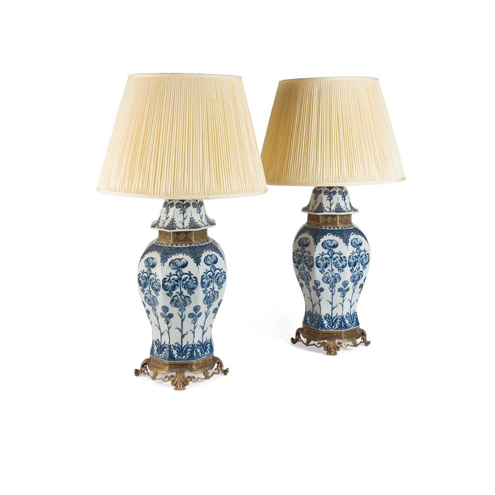 Lot 442 - PAIR OF BLUE AND WHITE POTTERY AND GILT METAL MOUNTED BALUSTER LAMPS