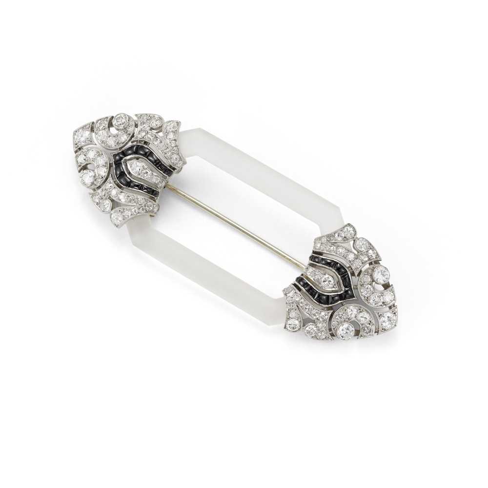 Lot 32 - An Art Deco frosted rock crystal, onyx and diamond brooch, circa 1925