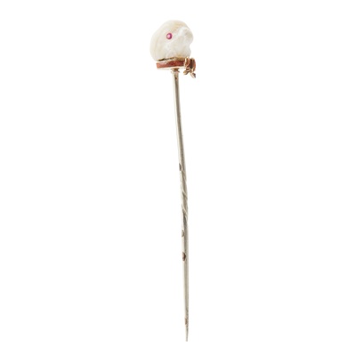Lot 140 - A natural pearl and ruby set 'Dog' stick pin