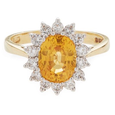 Lot 168 - A yellow sapphire and diamond set cluster ring