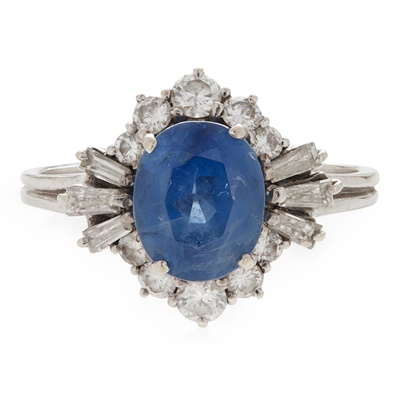 Lot 104 - A sapphire and diamond set cluster ring