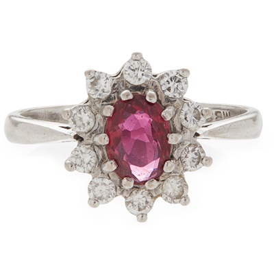 Lot 87 - A ruby and diamond set cluster ring