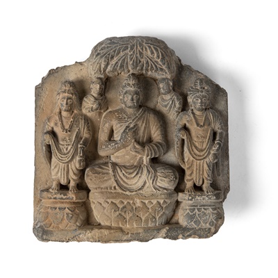Lot 285 - SCHIST PANEL WITH SEATED BUDDHA FLANKED BY ATTENDANTS