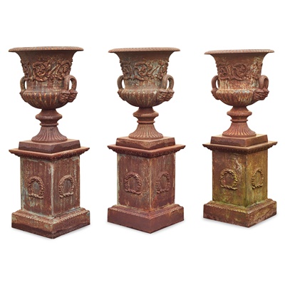 Lot 512 - GROUP OF THREE CAST IRON GARDEN URNS AND PLINTHS