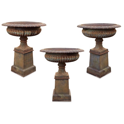 Lot 513 - SET OF THREE LARGE CAST IRON GARDEN URNS AND PLINTHS