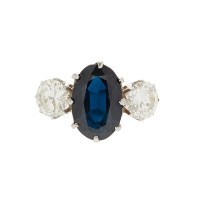 Lot 56 - A sapphire and diamond set three stone ring