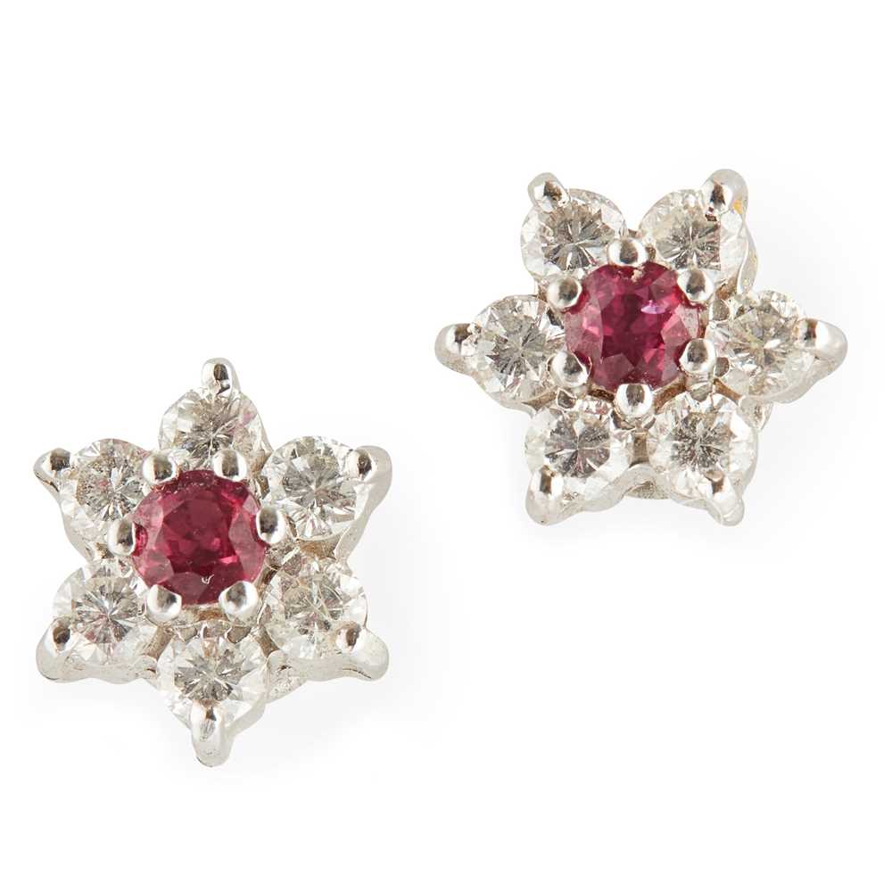 Lot 70 - A pair of ruby and diamond set cluster earrings