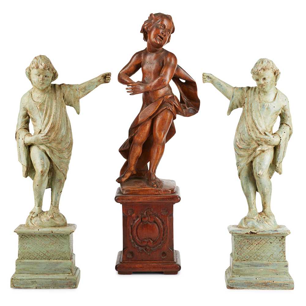 Lot 114 - THREE CARVED WOOD FIGURES OF PUTTI
