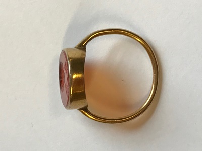 Lot 114 - A silver gilt mounted carnelian intaglio ring