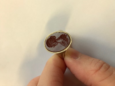 Lot 115 - A gold mounted carnelian intaglio ring