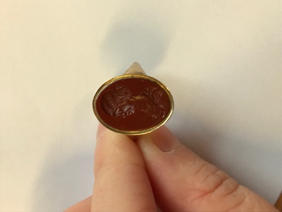 Lot 115 - A gold mounted carnelian intaglio ring