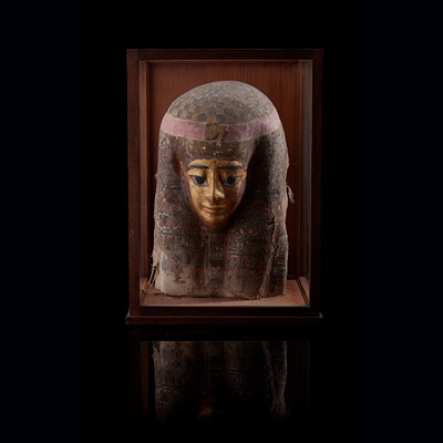 Lot 113 - AN ANCIENT EGYPTIAN PTOLEMAIC GILT CARTONNAGE MASK
