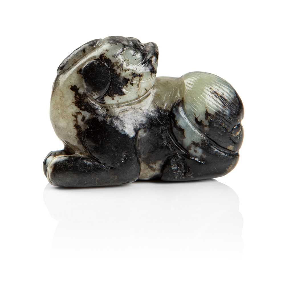 Lot 87 - BLACK AND CELADON JADE CARVING OF A LUDUAN