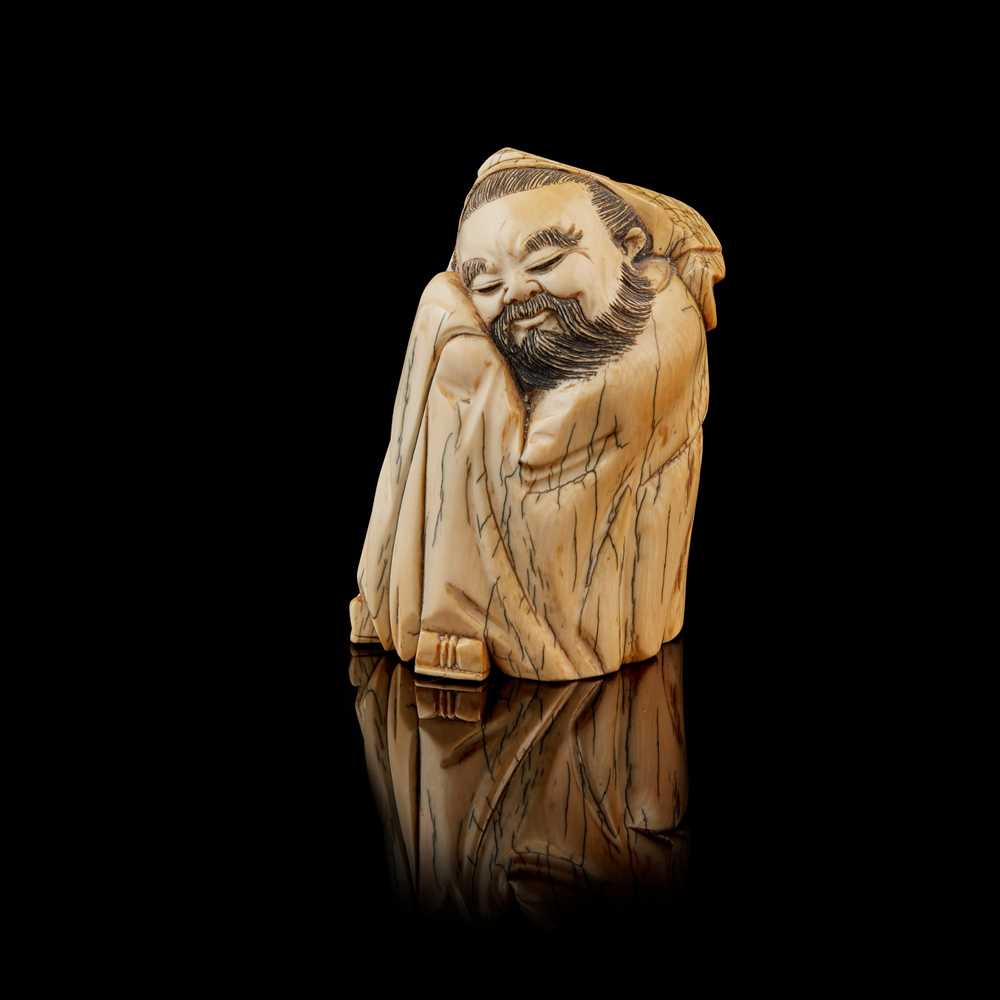 Lot 18 - IVORY CARVING OF A NAPPING SCHOLAR