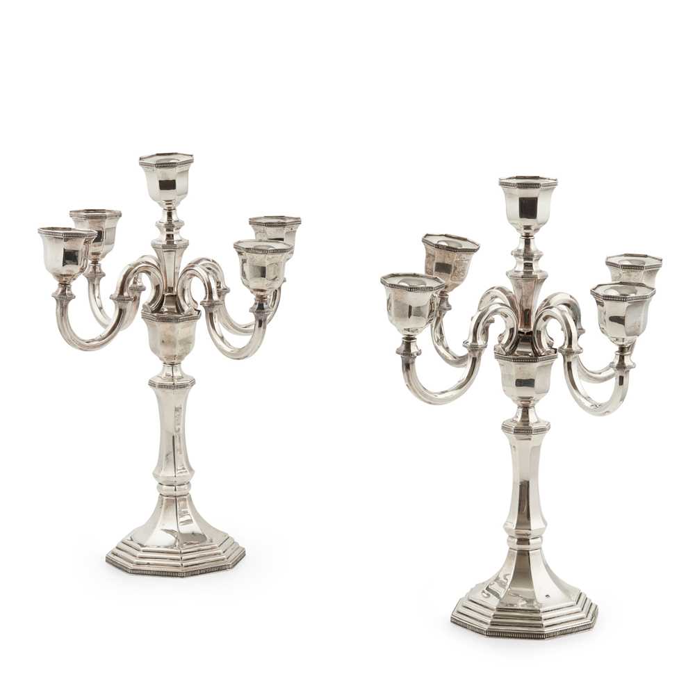 Lot 211 - A George I style four branch candelabra