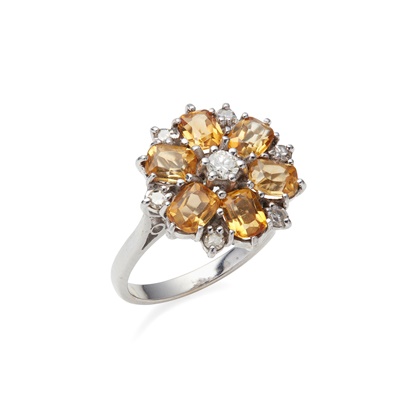 Lot 32 - A citrine and diamond set cluster ring