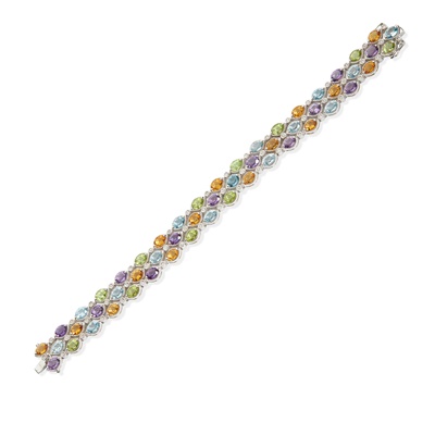 Lot 81 - An 18ct gold diamond multi-gem bracelet