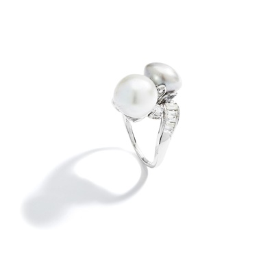 Lot 57 - A mid 20th century pearl and diamond dress ring