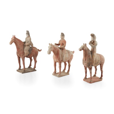 Lot 75 - GROUP OF THREE PAINTED POTTERY HORSES AND RIDERS