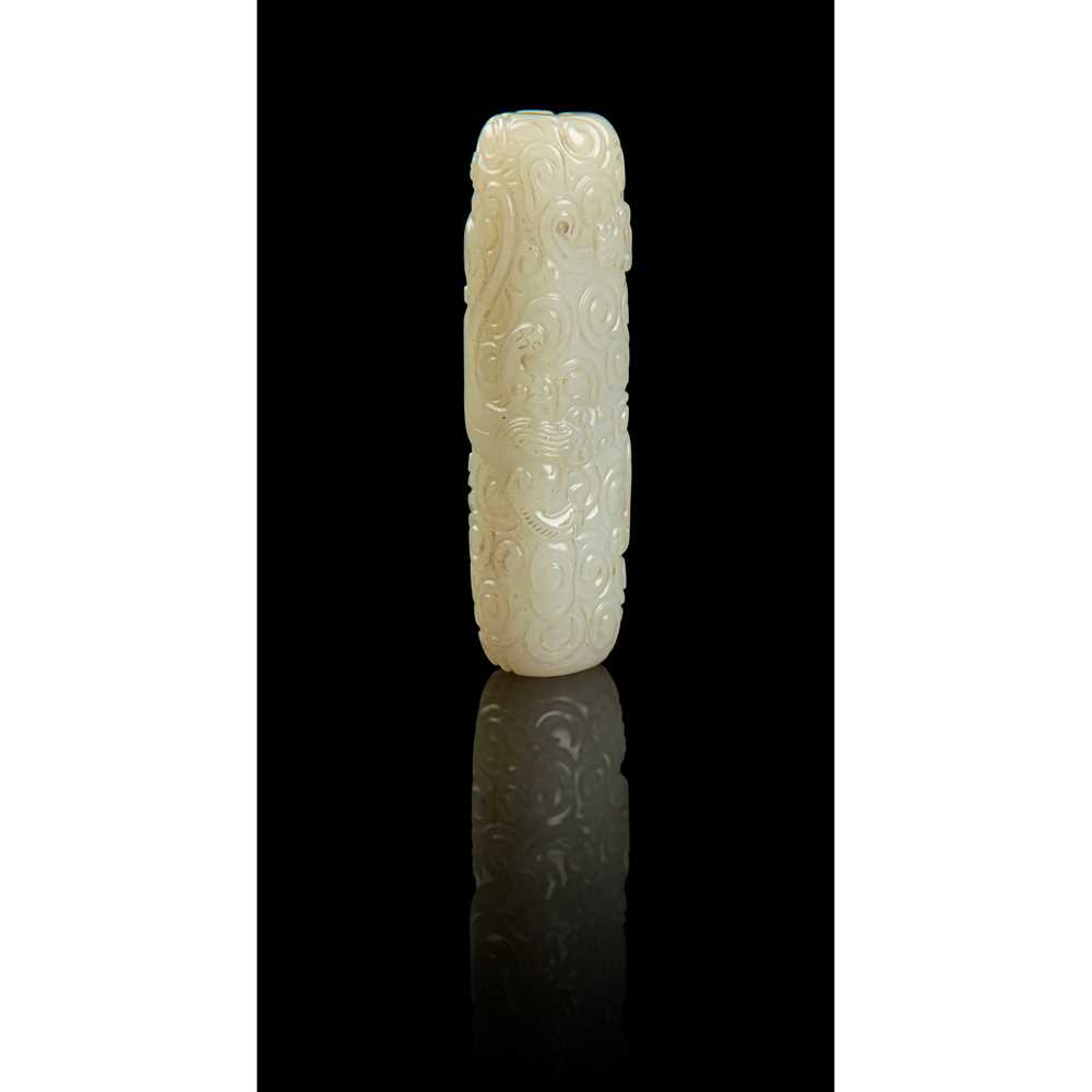 Lot 123 - WHITE JADE CARVING OF A 'DRAGON' ORNAMENT