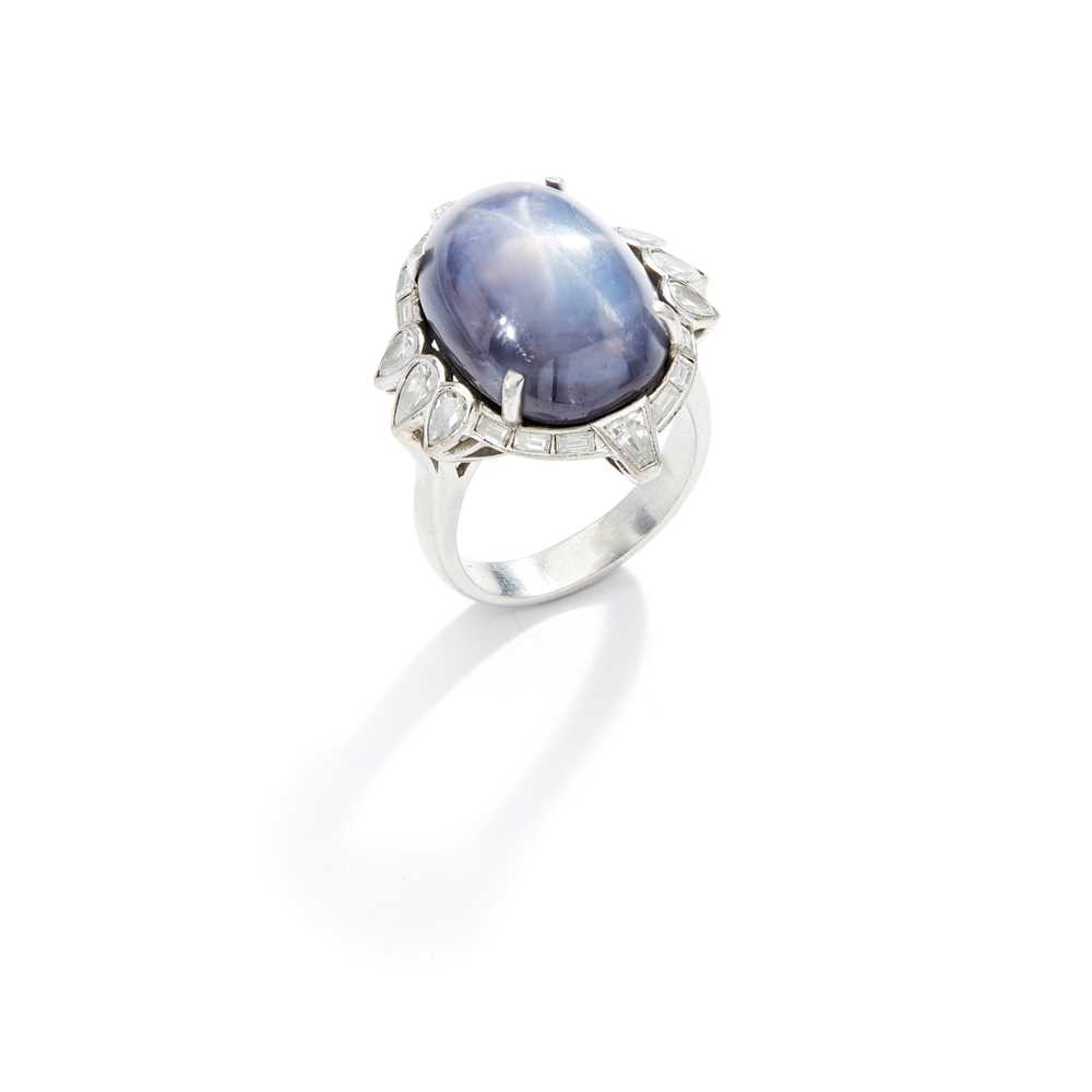 Lot 53 - A star sapphire and diamond ring, 1940s