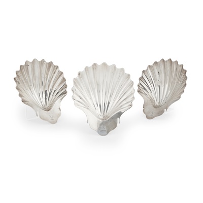 Lot 75 - A set of three George III scallop butter dishes