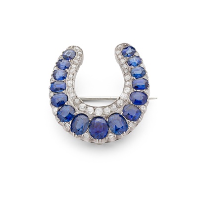 Lot 405 - A sapphire and diamond horseshoe brooch