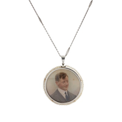 Lot 151 - An early 20th-Century pearl and enamelled portrait pendant