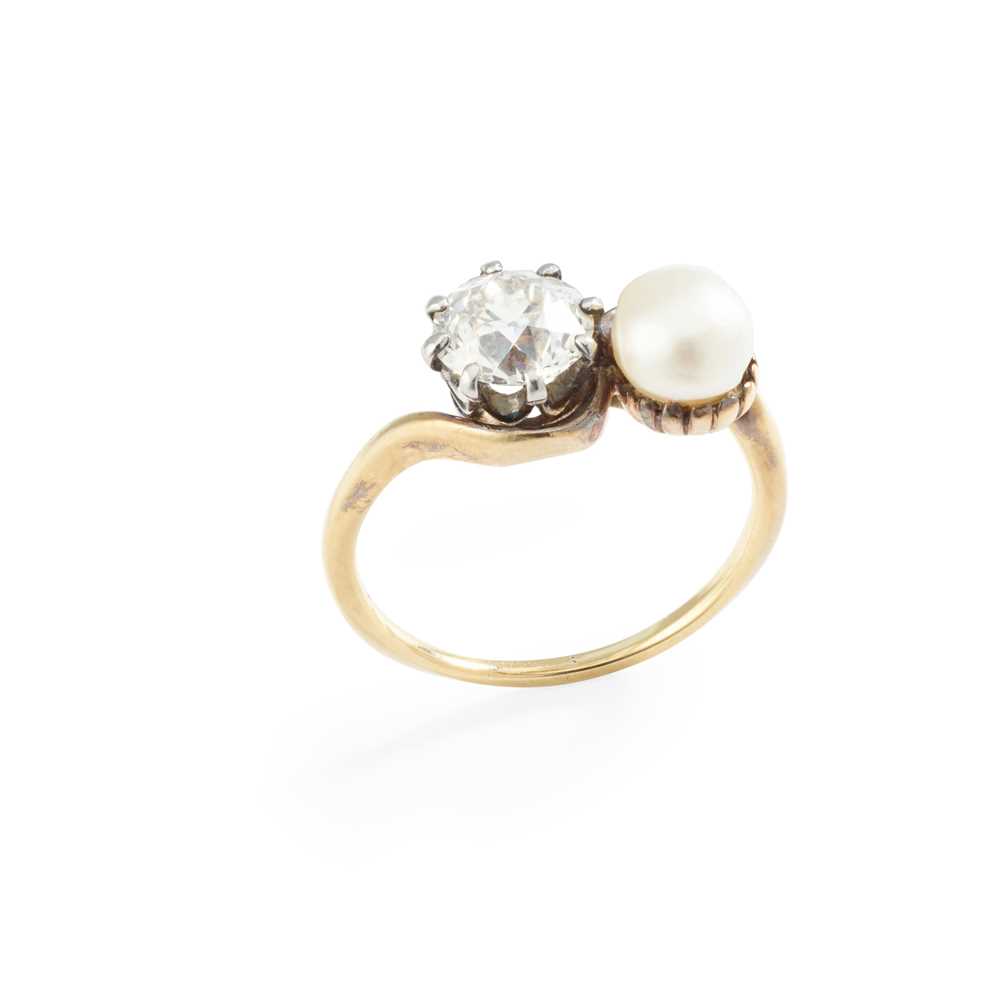 Lot 174 - An early 20th-Century pearl and diamond 'moi-et-toi' ring