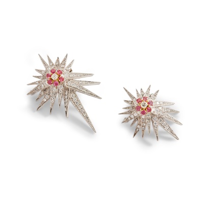 Lot 69 - A pair of ruby and diamond star brooches