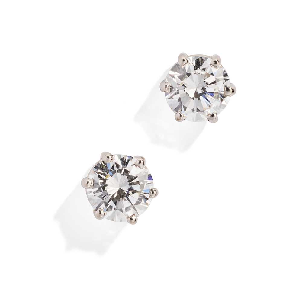 Lot 74 - A pair of diamond single-stone earrings