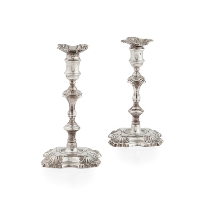 Lot 131 - A pair of George II candlesticks