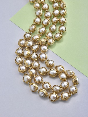 Lot 66 - A 'Wrapped' cultured pearl two-strand necklace, by Charles de Temple, 1968