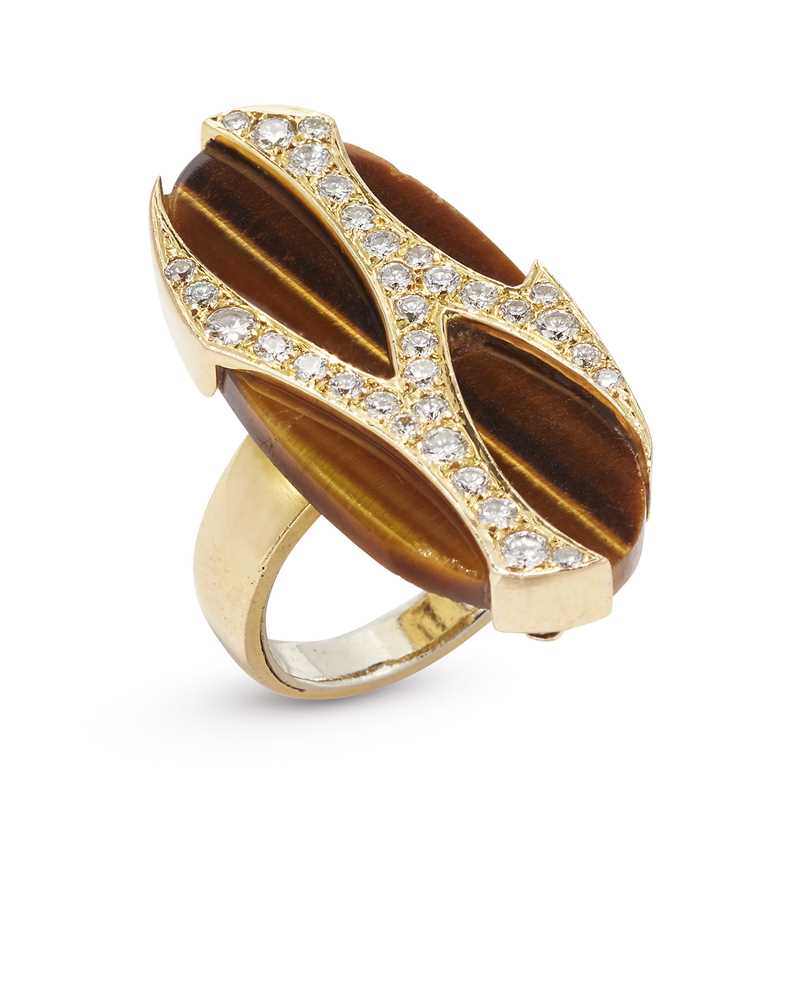 Lot 57 - A tiger's eye quartz and diamond dress ring